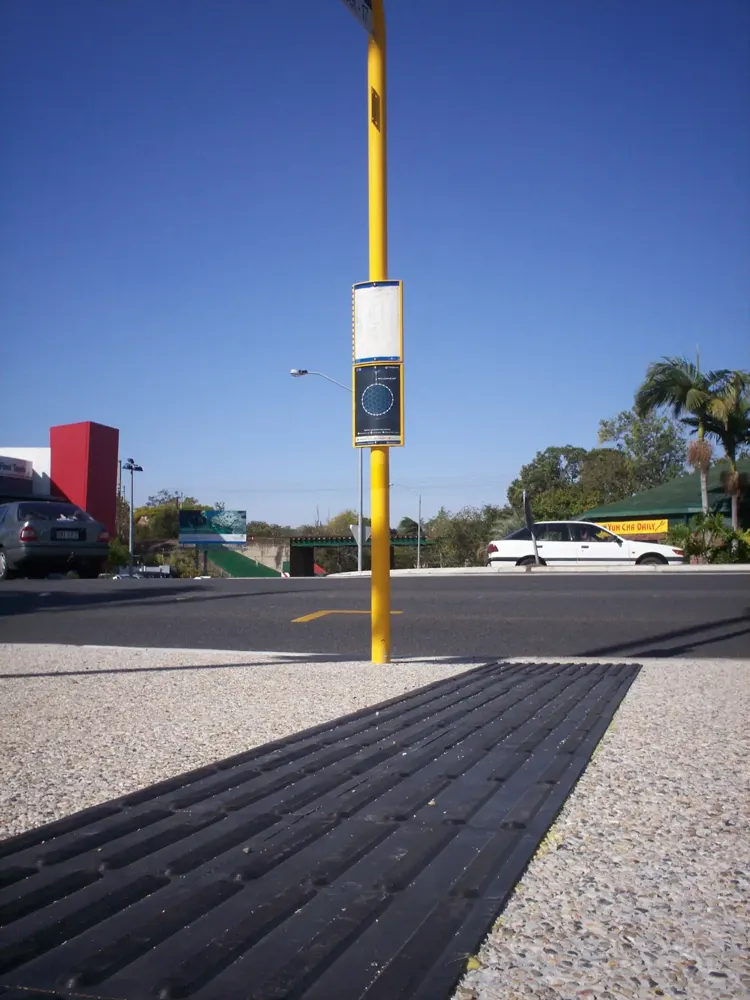 Poly stick-down tactile ground surface indicators at a bus stop